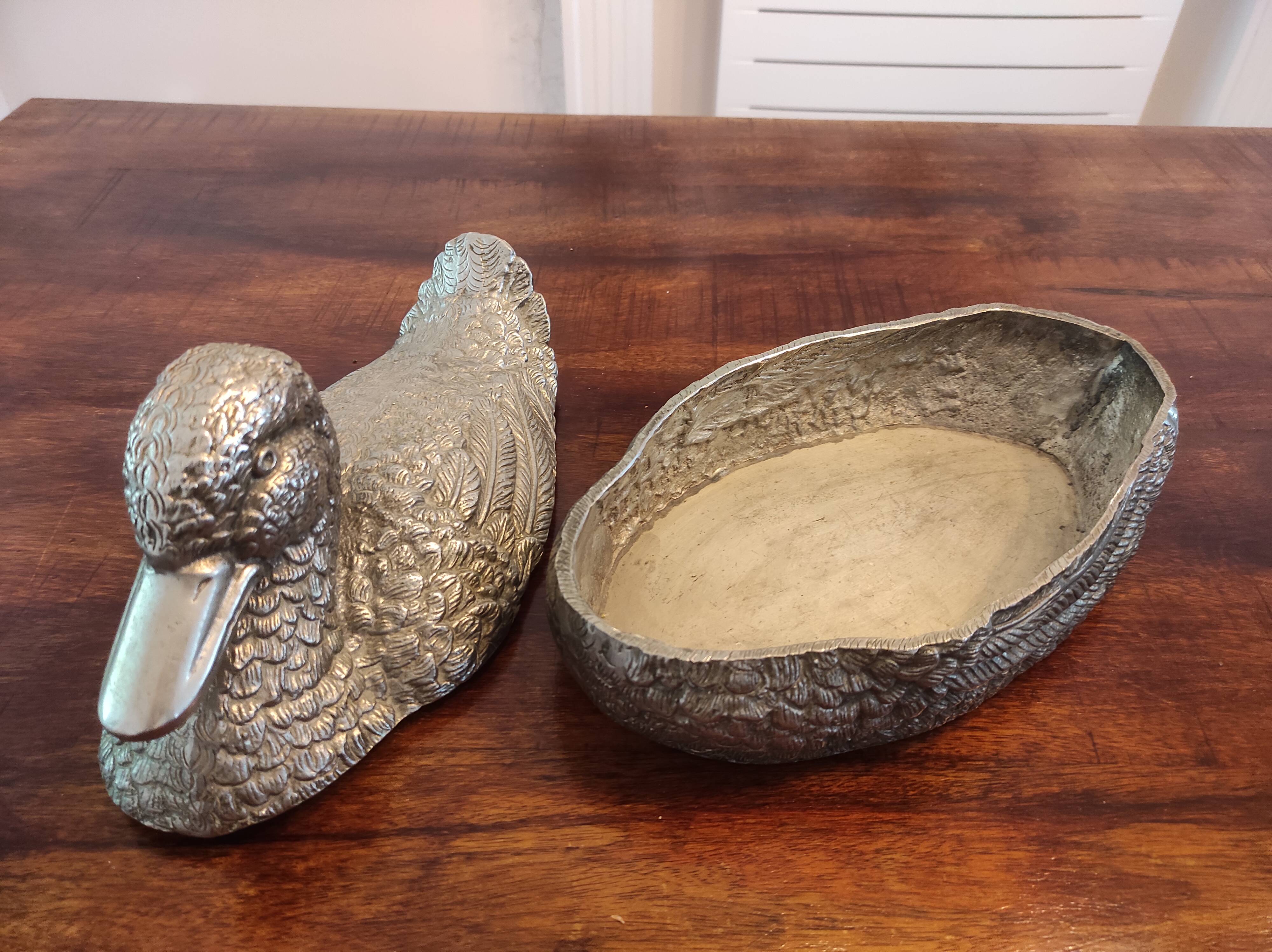 Large silver metal duck