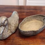 Large silver metal duck