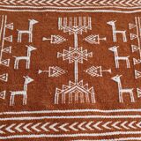 White and brown kilim carpet with gazelle patterns