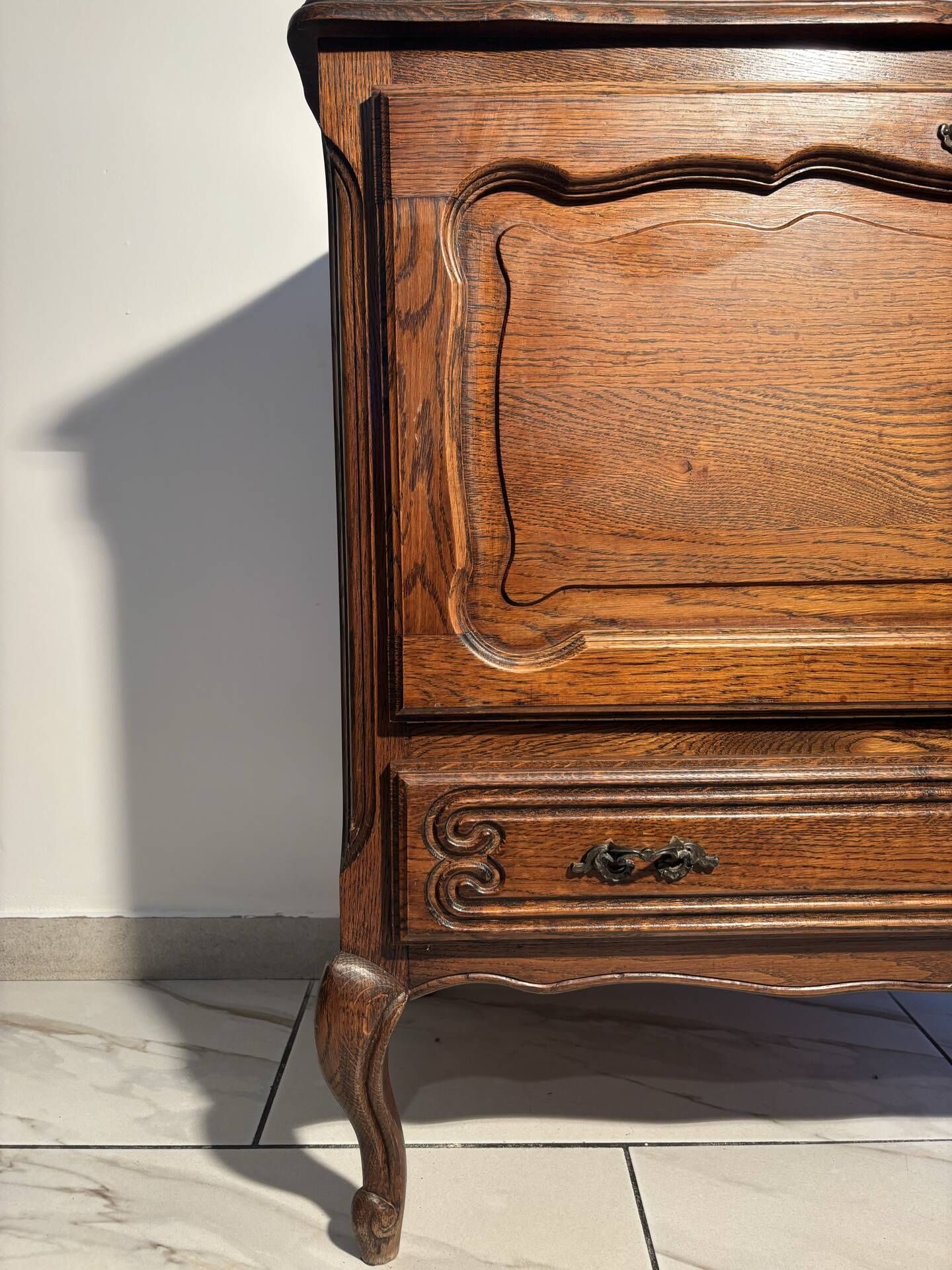 Louis XV style oak TV cabinet with drop-down flap.
