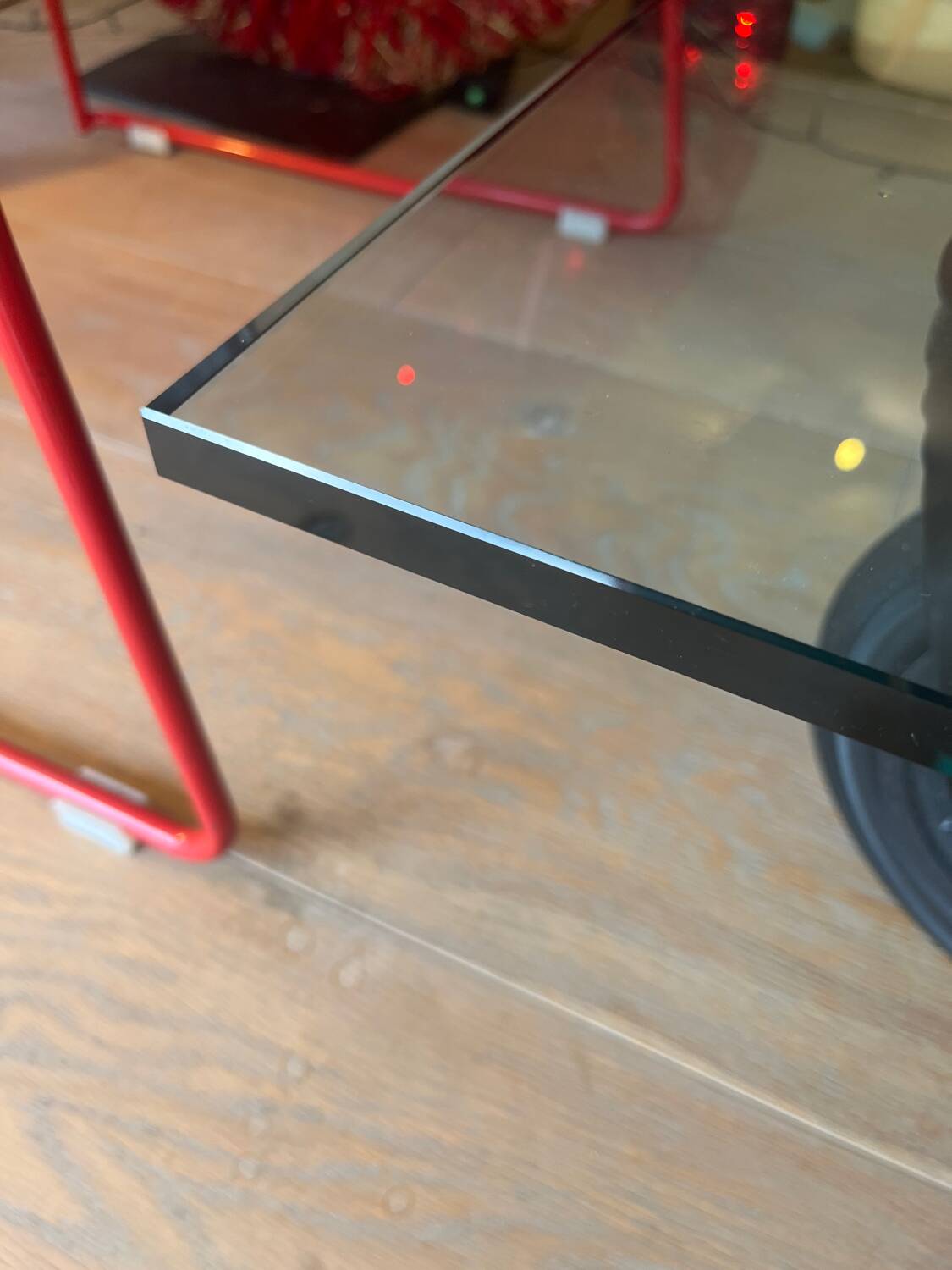 Gae Aulenti coffee table for Fontana Arte, transparent glass top with black cast iron supports, 1980s.