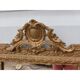 19th-century mirror in gilded wood and stucco.