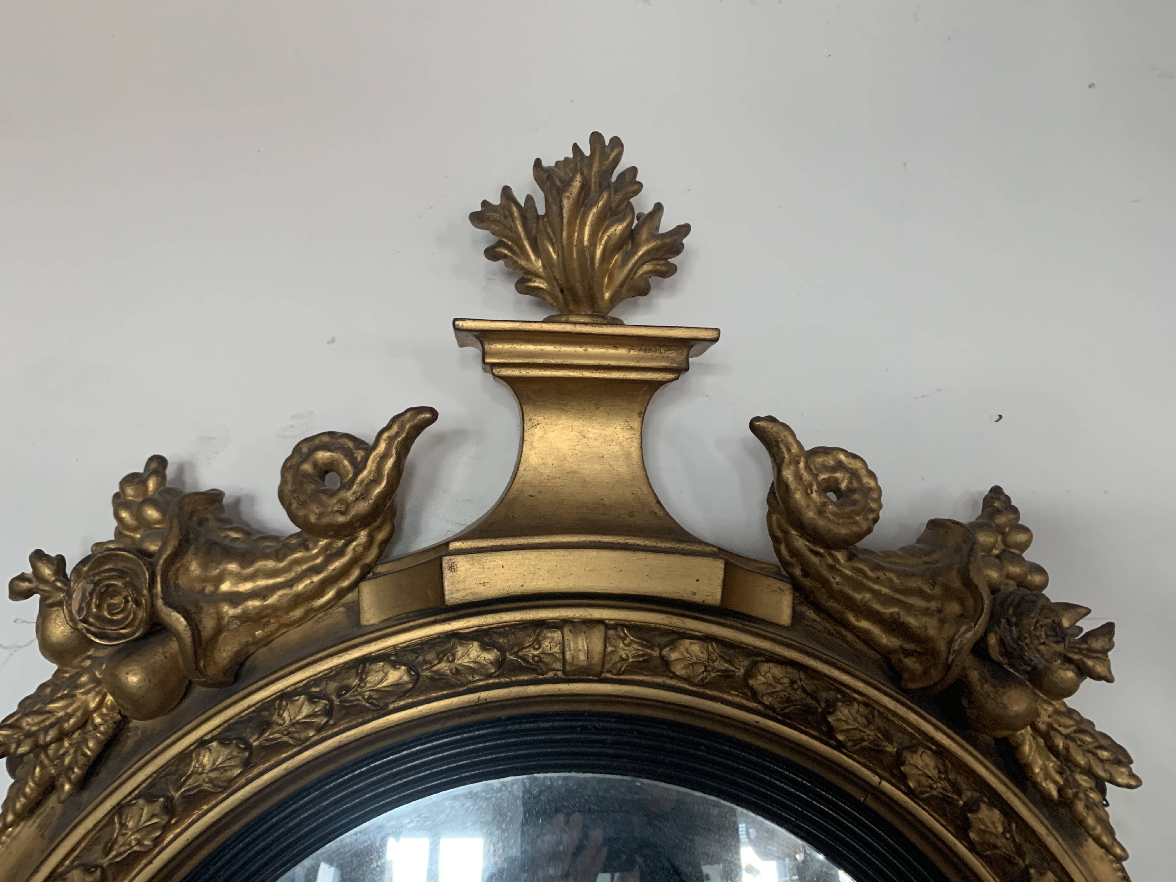 Miroir sorcière en bois sculpté doré XIX siècle