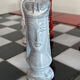 Chess set with ceramic board and pieces.