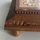 Vintage wooden and antique earthenware trivet, brown tile design