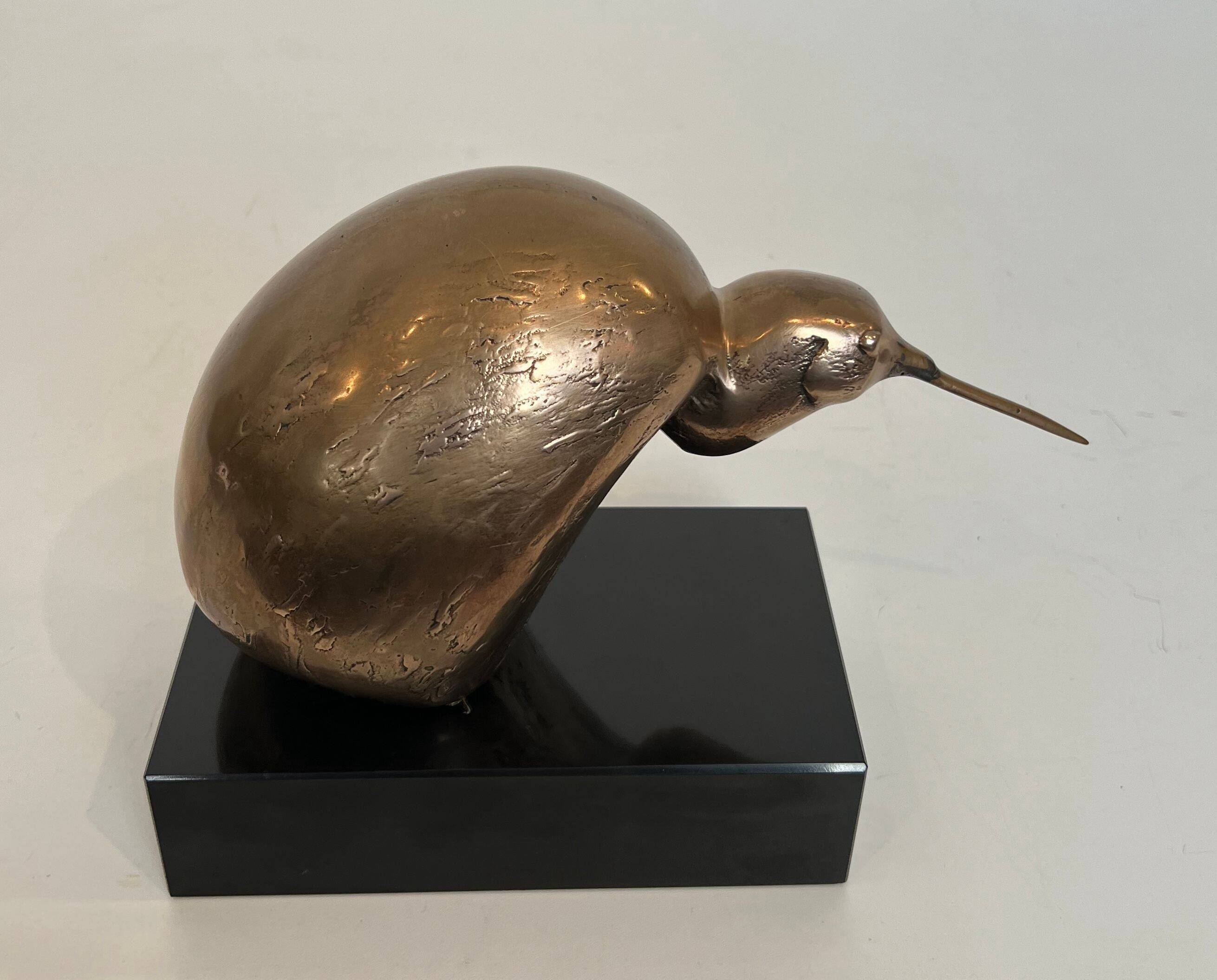 Bronze sculpture representing a stylised bird on a black marble base, signed and numbered.