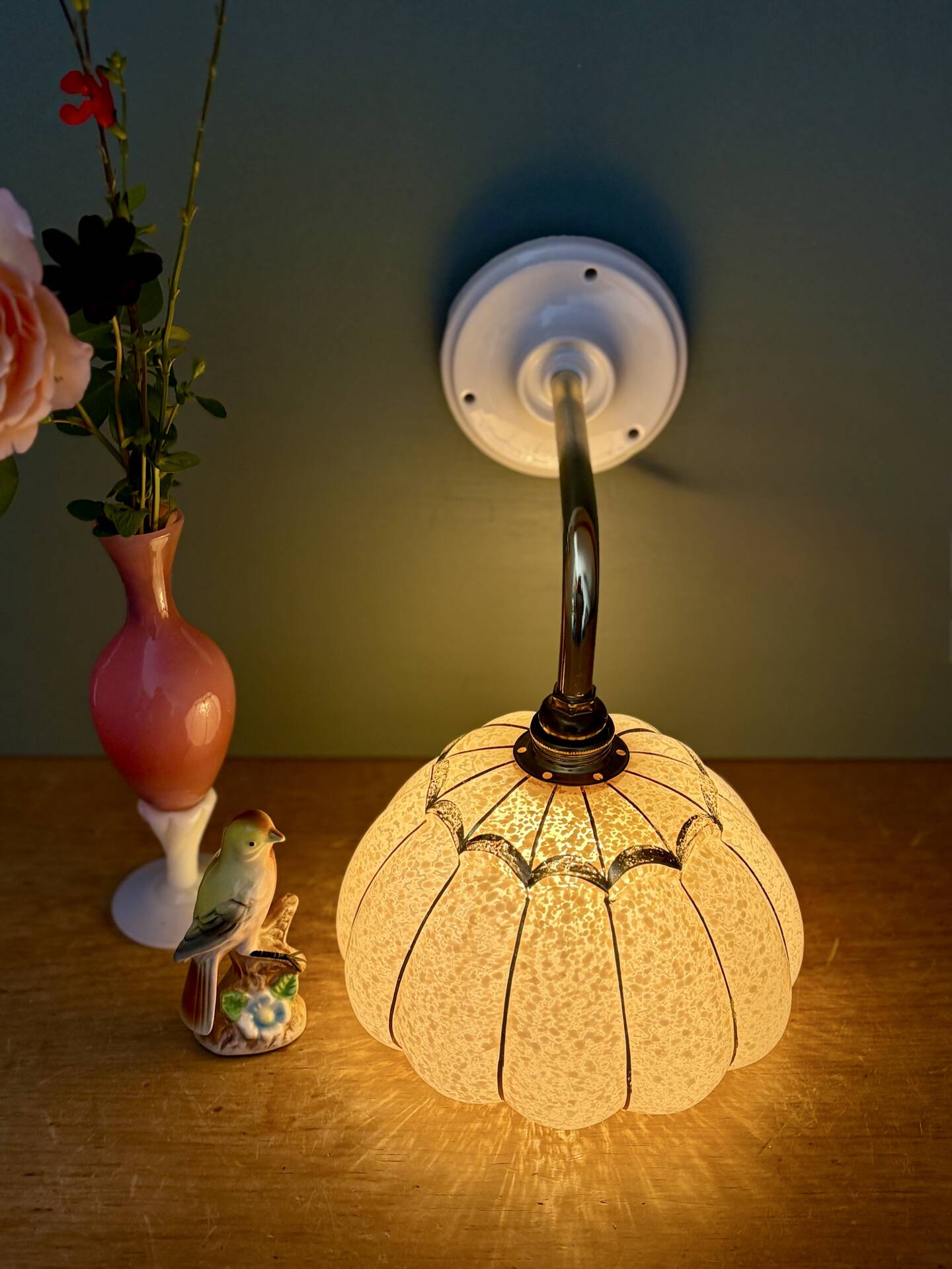 Vintage glass wall light with a pink and gold Clichy globe.
