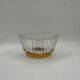 Crown coupe in ribbed glass with a brass base.