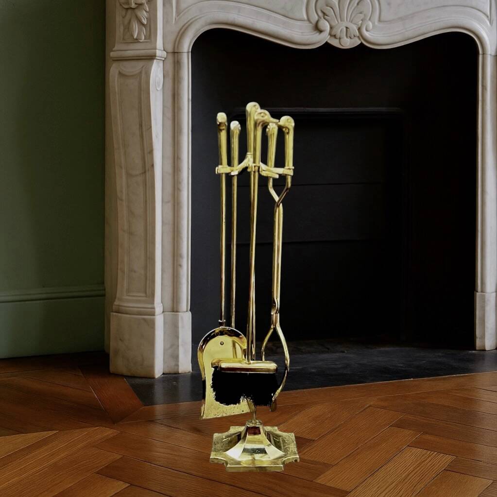 Antique fireplace tool in gilded zamak with duck head designs.