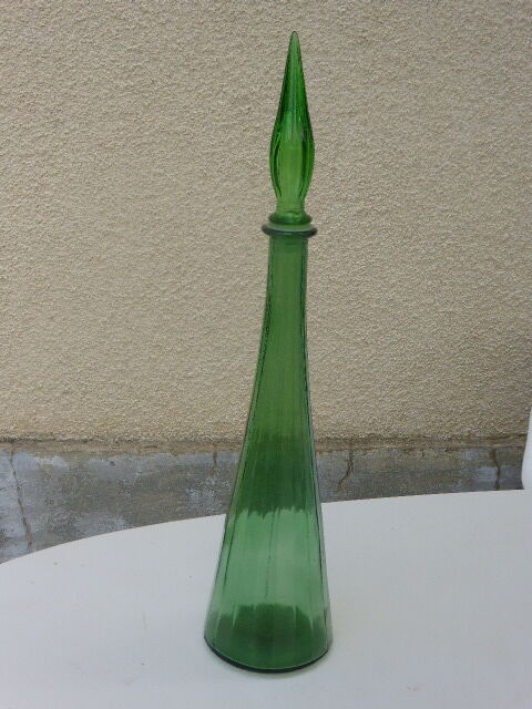 Vintage green faceted glass bottle with its cap 1970