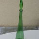 Vintage green faceted glass bottle with its cap 1970