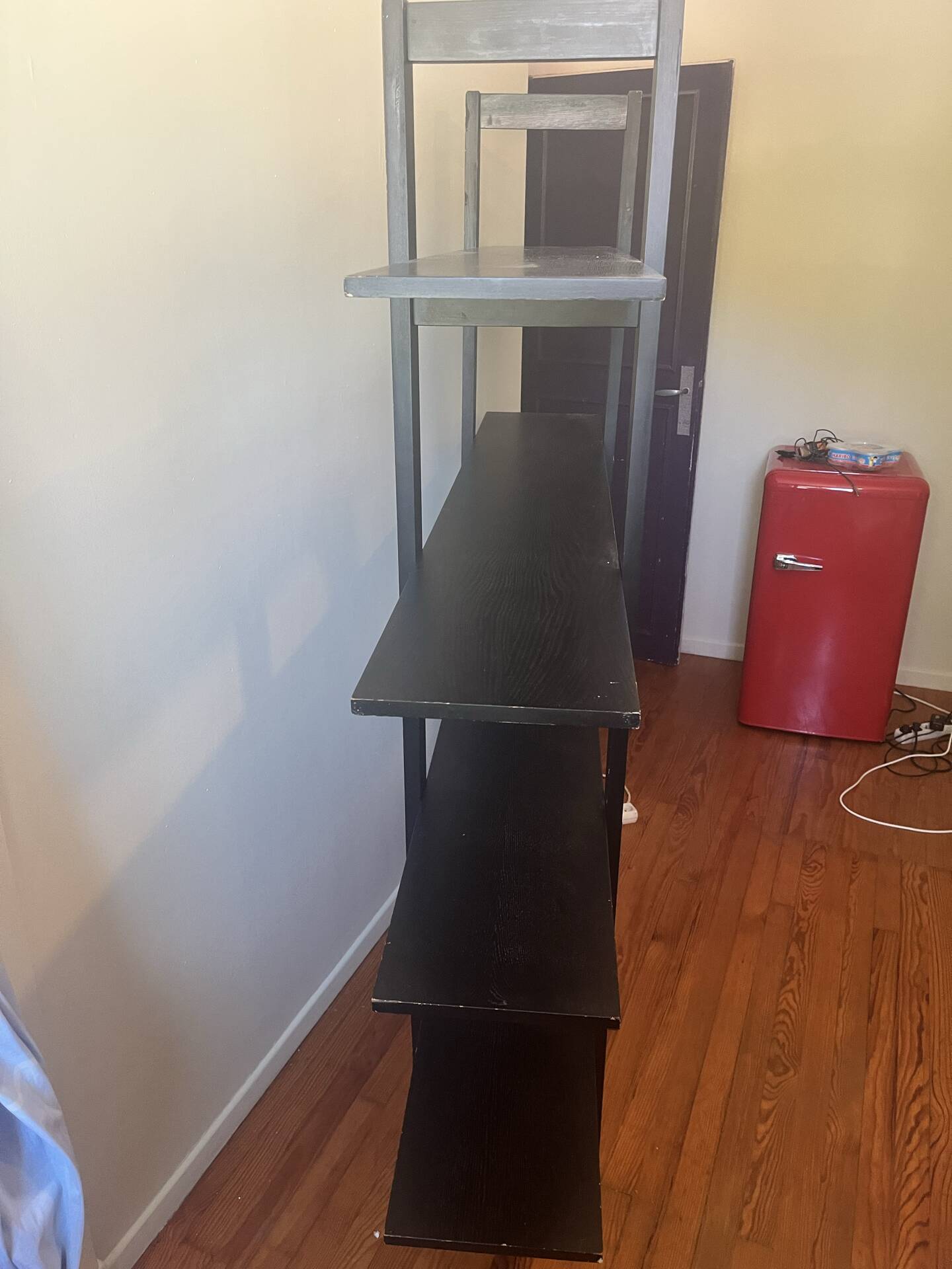 Large vintage bookshelf in solid black wood, Scandinavian style.