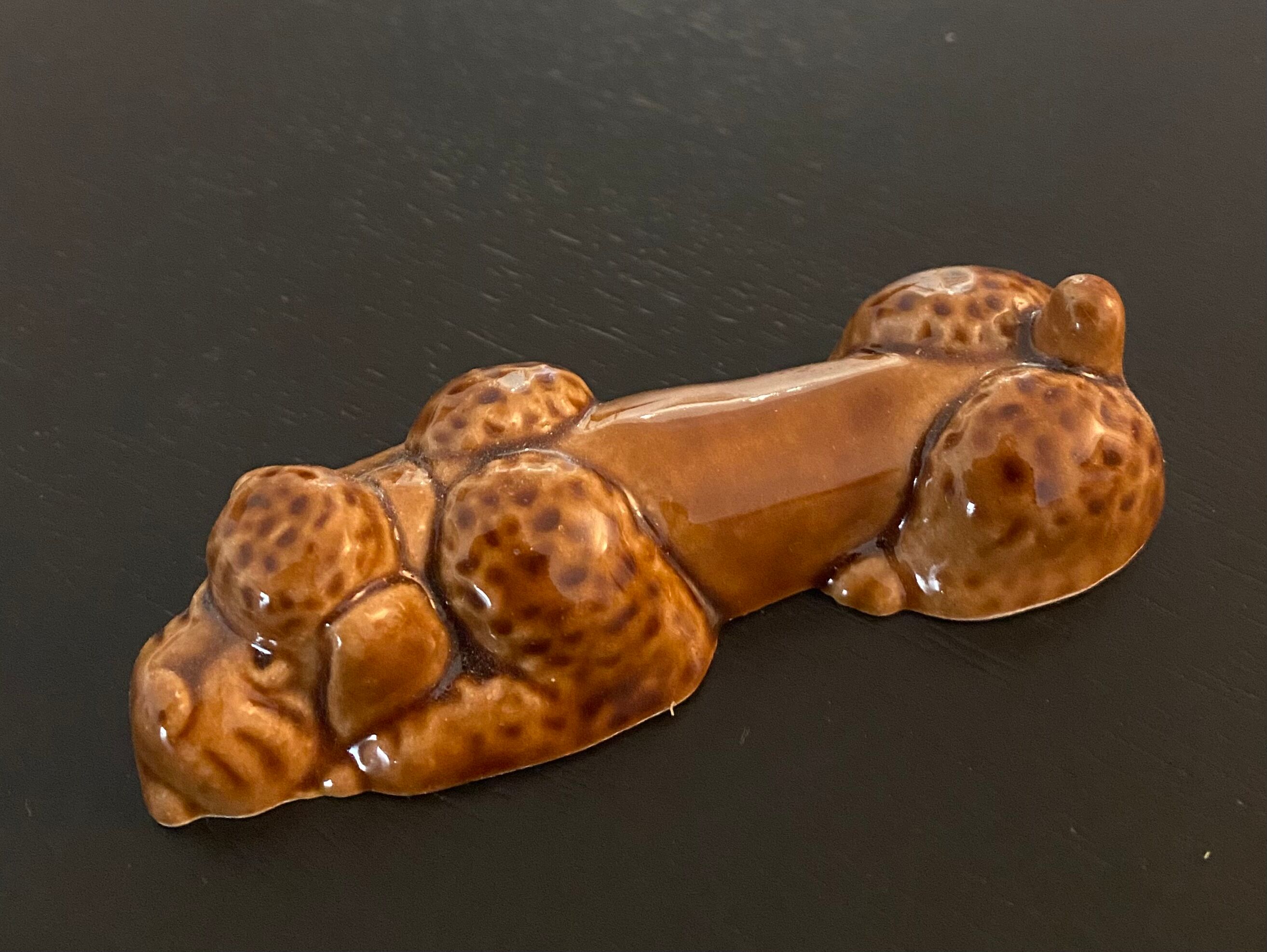 10 ceramic knife holders in the shape of a recumbent poodle
