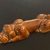 10 ceramic knife holders in the shape of a recumbent poodle