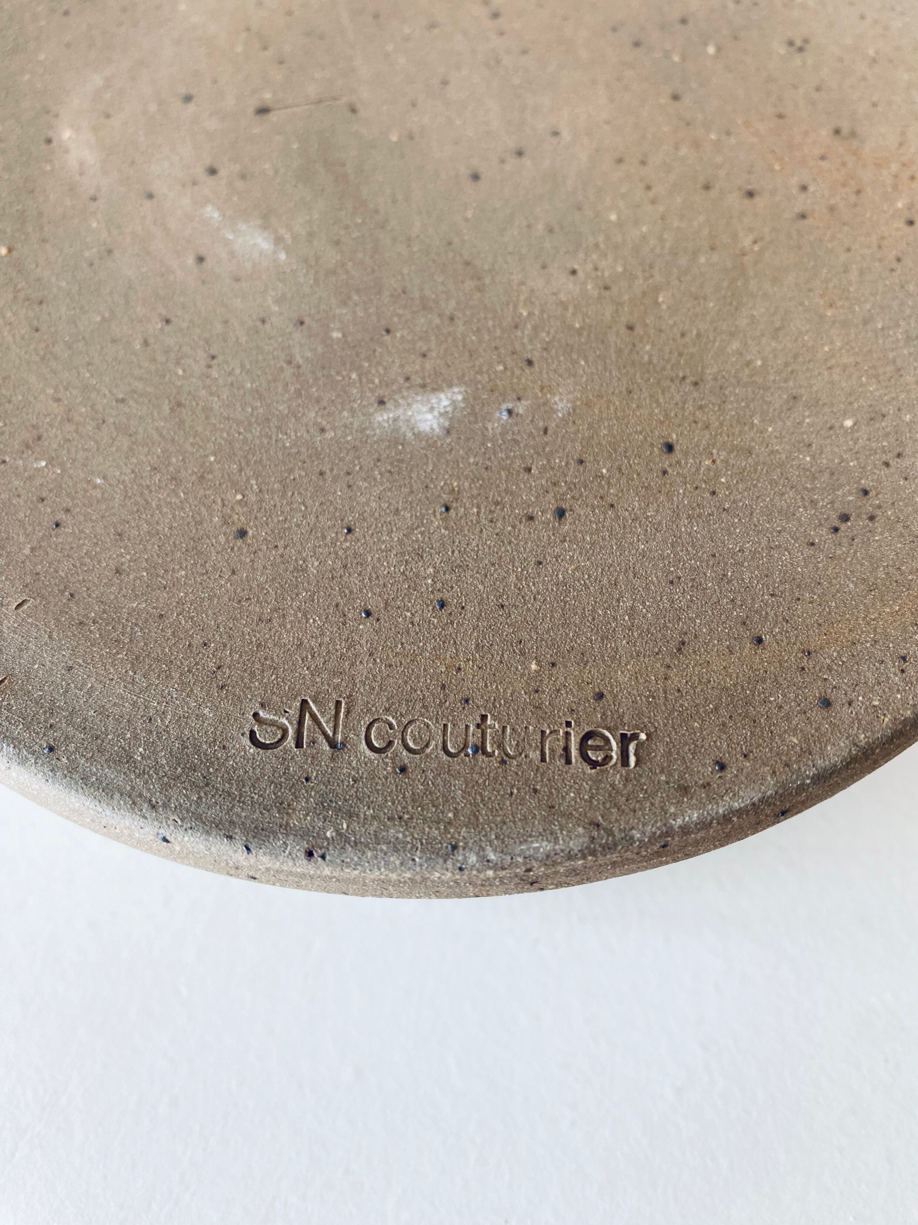 Stoneware ashtray signed Couturier