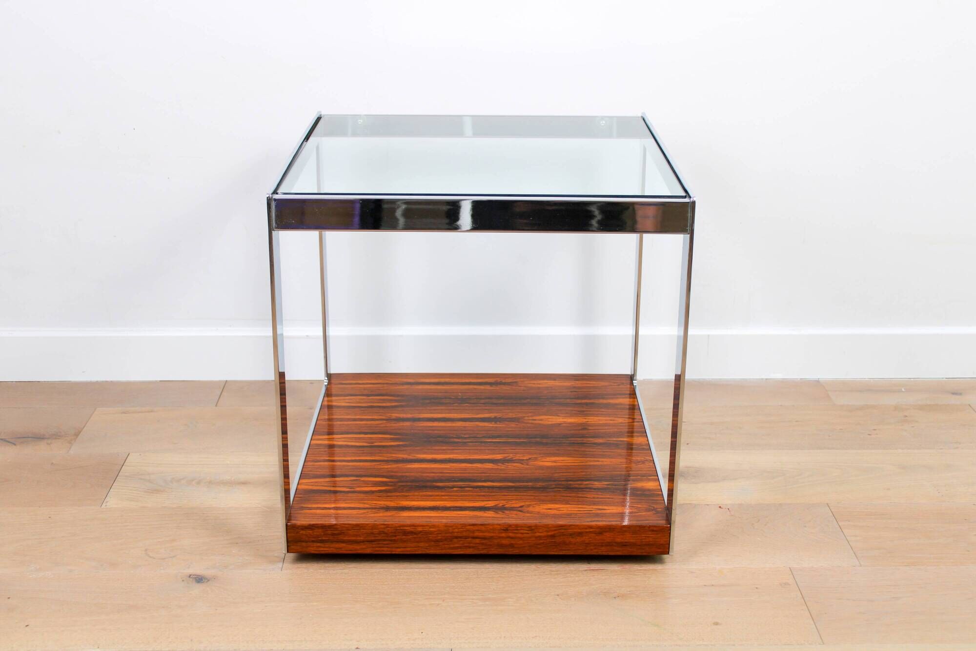 A vintage mid-century glass and rosewood side table by Merrow Associates