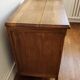 Beautiful old wooden furniture with three drawers.