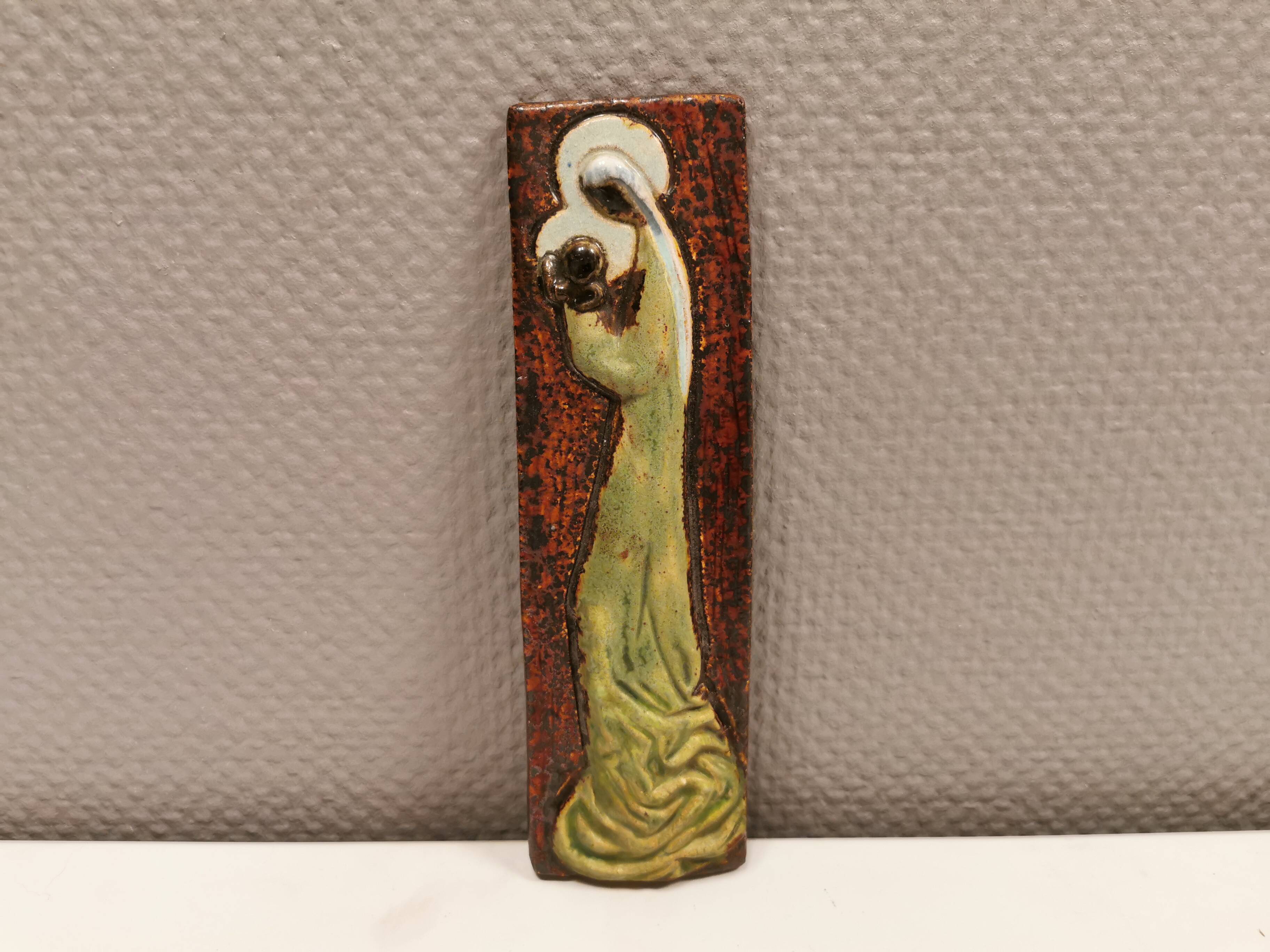 Slim relief with a motif of Madonna and child.