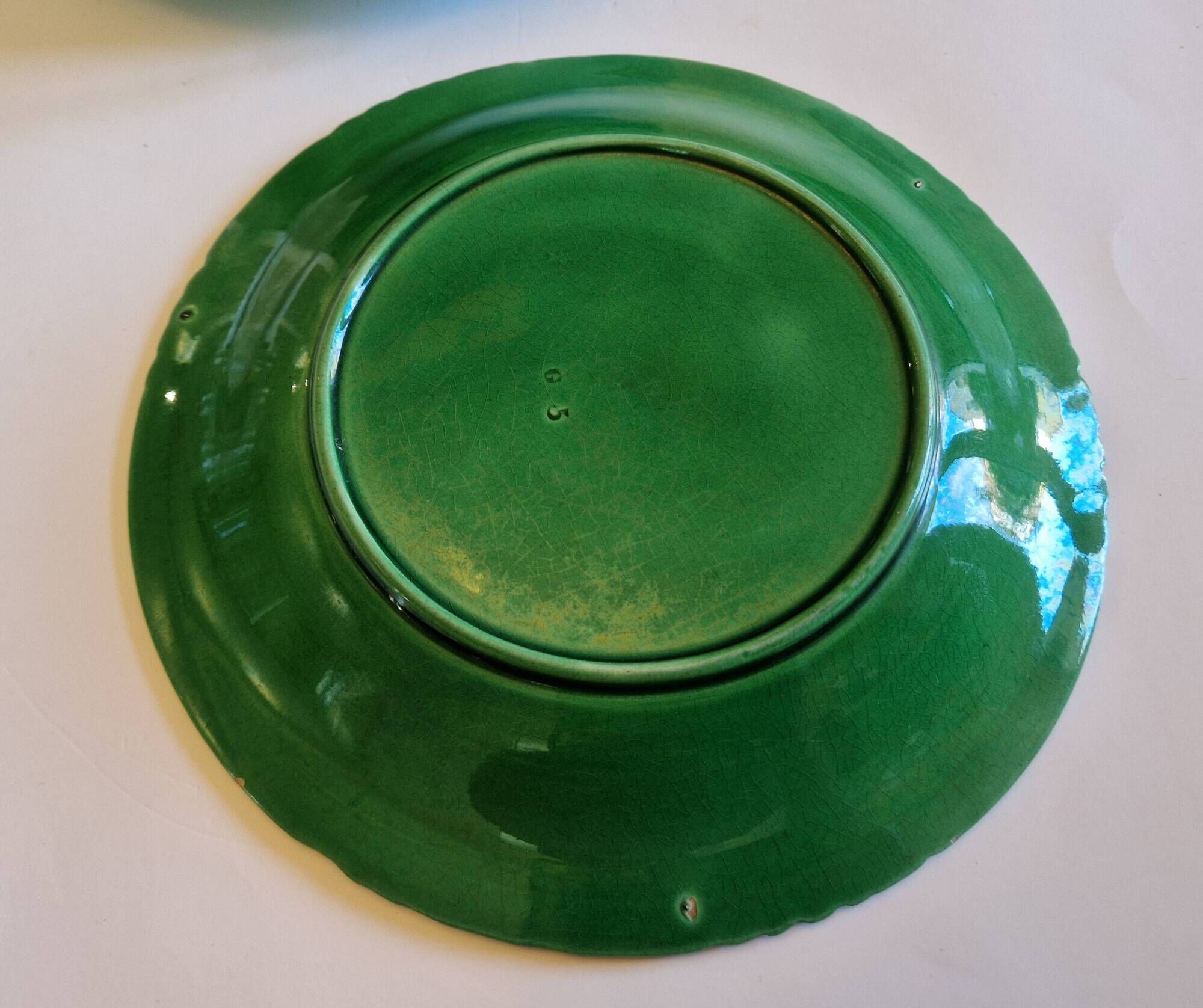8 green barbotine plates from the early 20th century.
