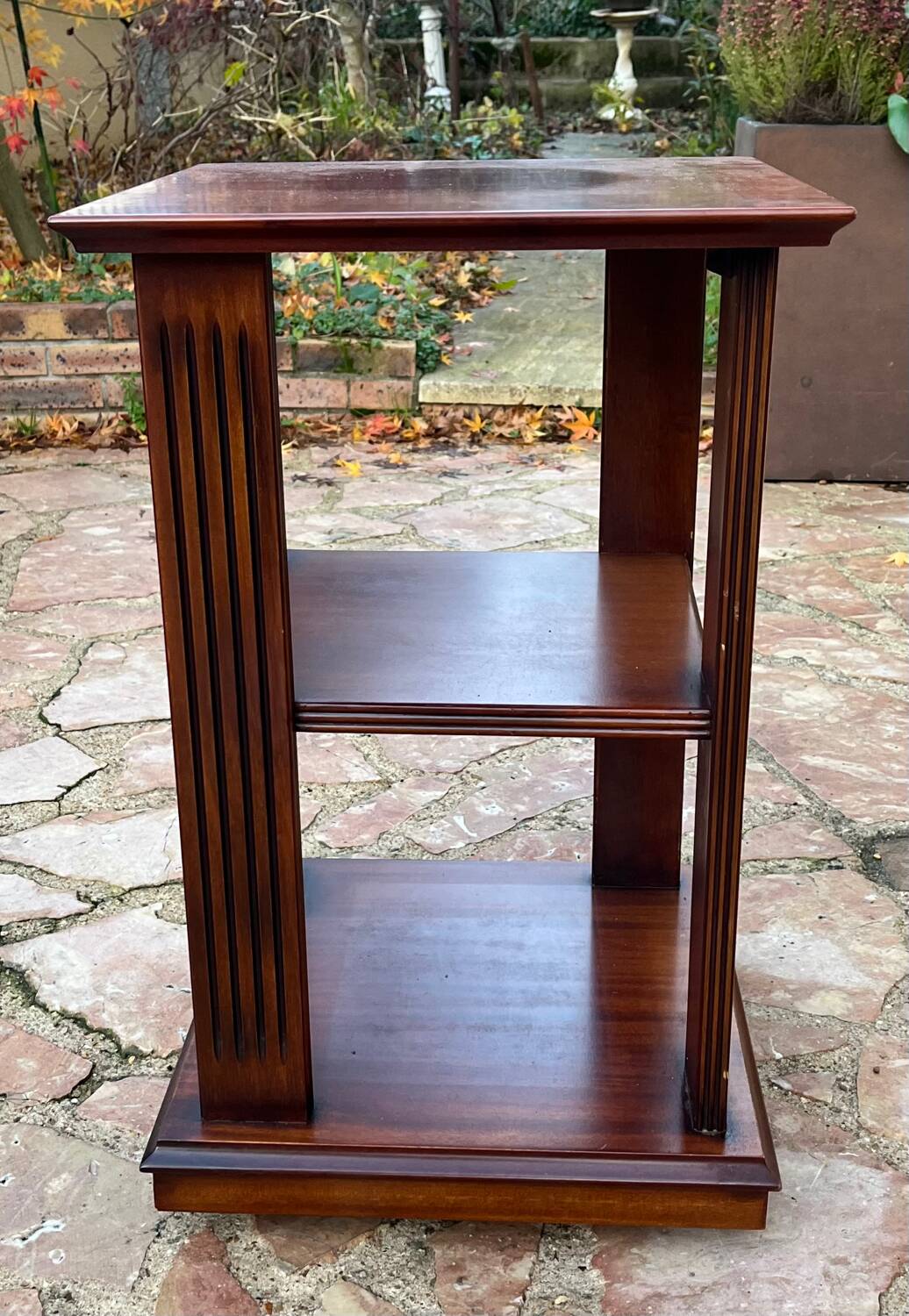 Vintage wooden shelf on caster legs