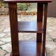Vintage wooden shelf on caster legs