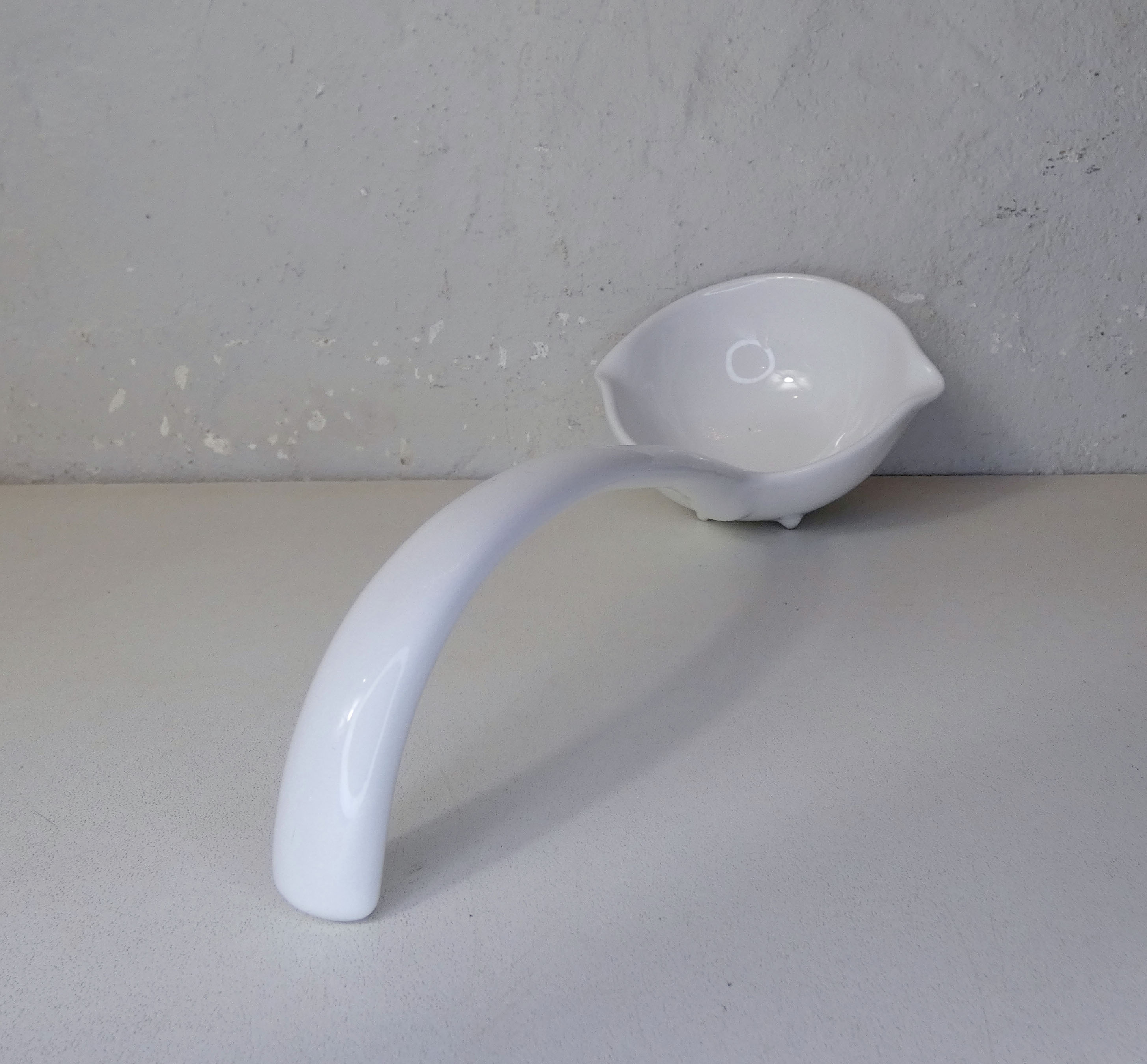 White ceramic ladle