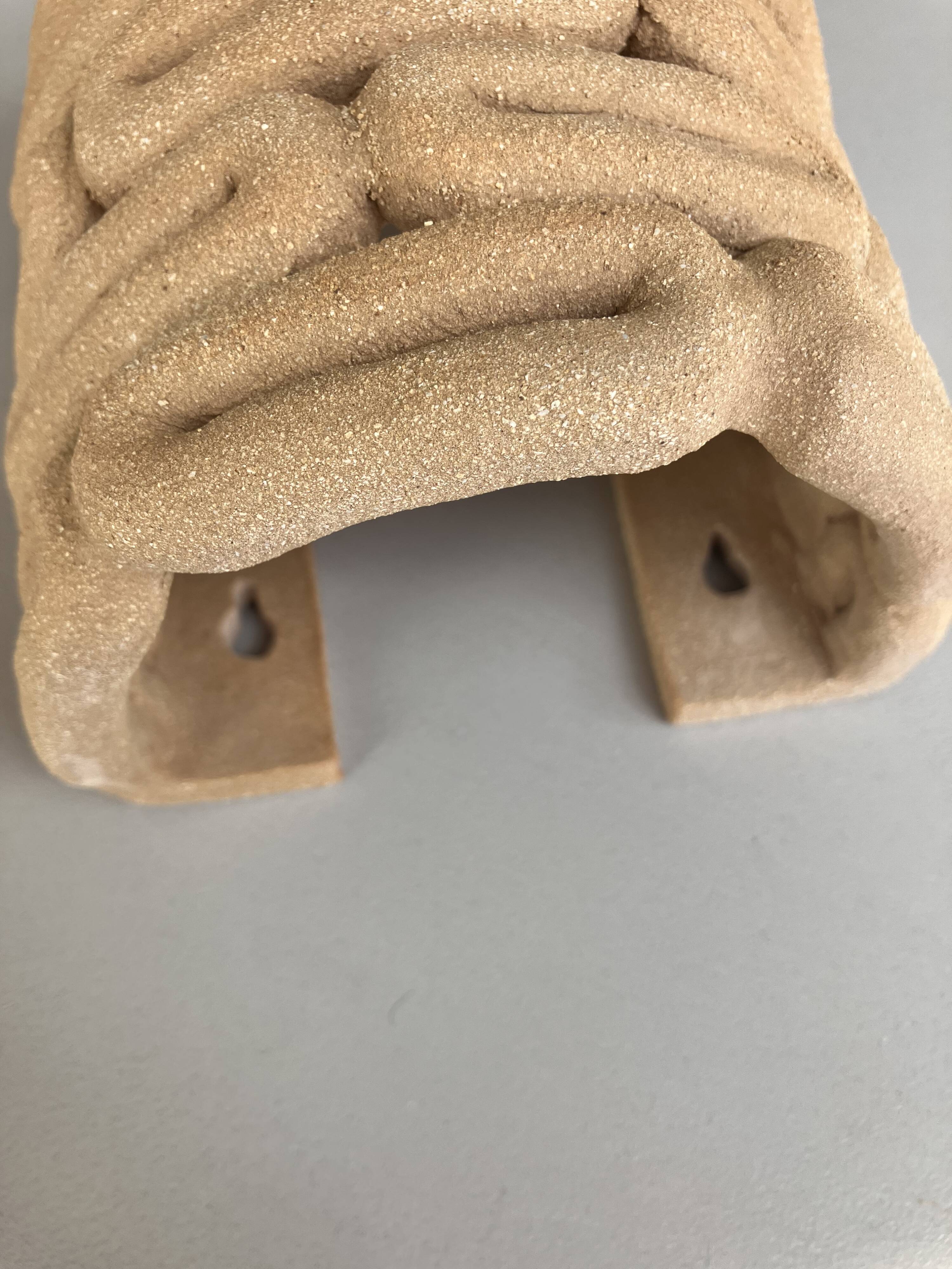 Handcrafted ceramic wall light in raw stoneware inspired by Mid Century design.