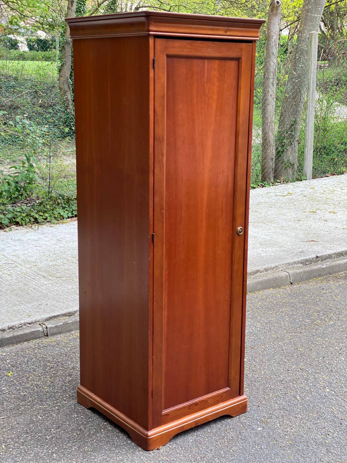 Louis Philippe wardrobe with a solid wood door.