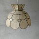 Suspension in mother-of-pearl and brass flower shape