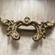 Antique oval brass crest mirror, 41x26 cm
