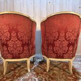 Pair of gondola armchairs in Louis XV style with highlighted wood.