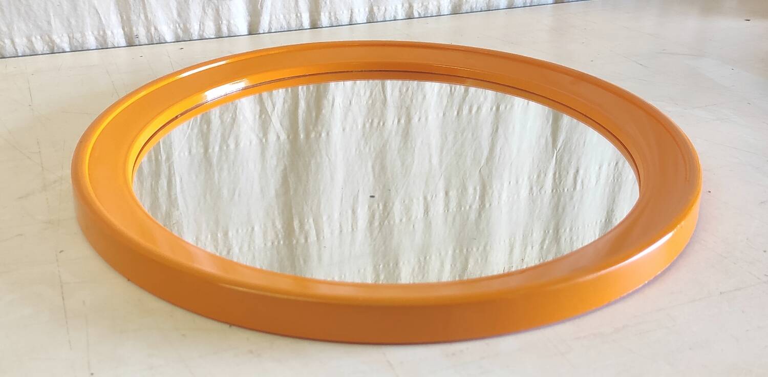 Round orange plastic mirror - 1970s
