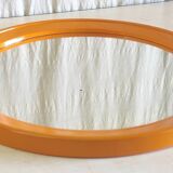 Round orange plastic mirror - 1970s