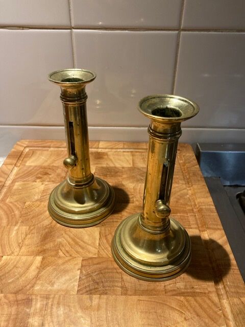 Pair of 19th-century brass pusher candlesticks
