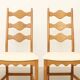 Four oak dining chairs by Henning Kjaernulf.