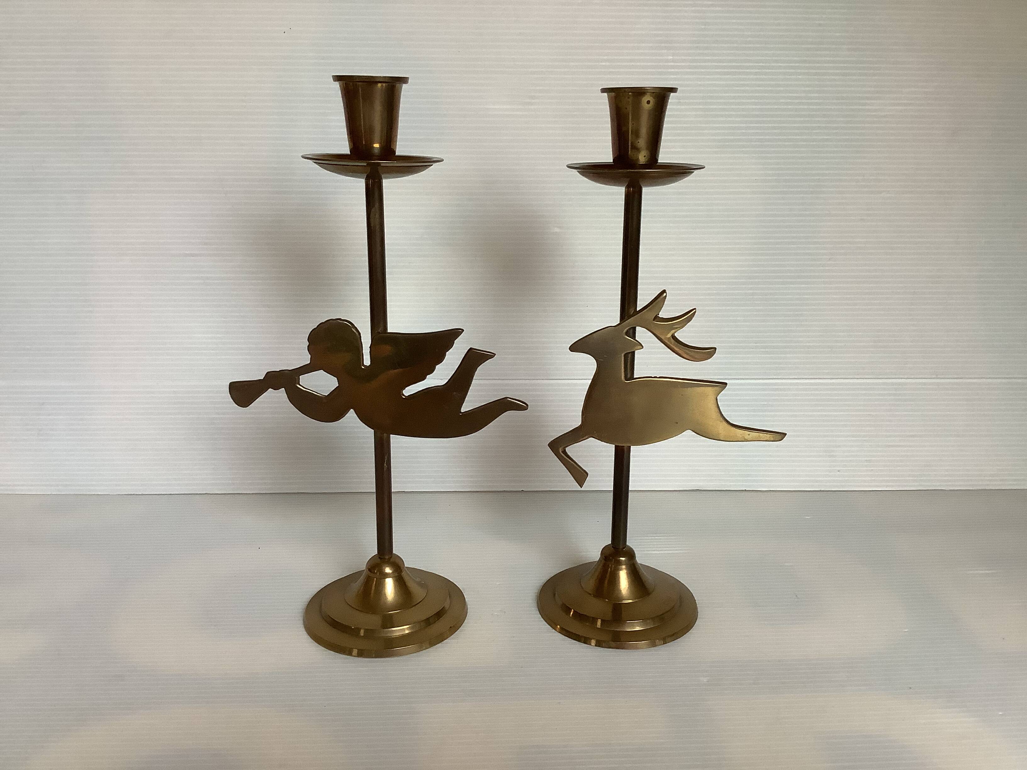 Pair of brass Christmas angel and reindeer candle holders