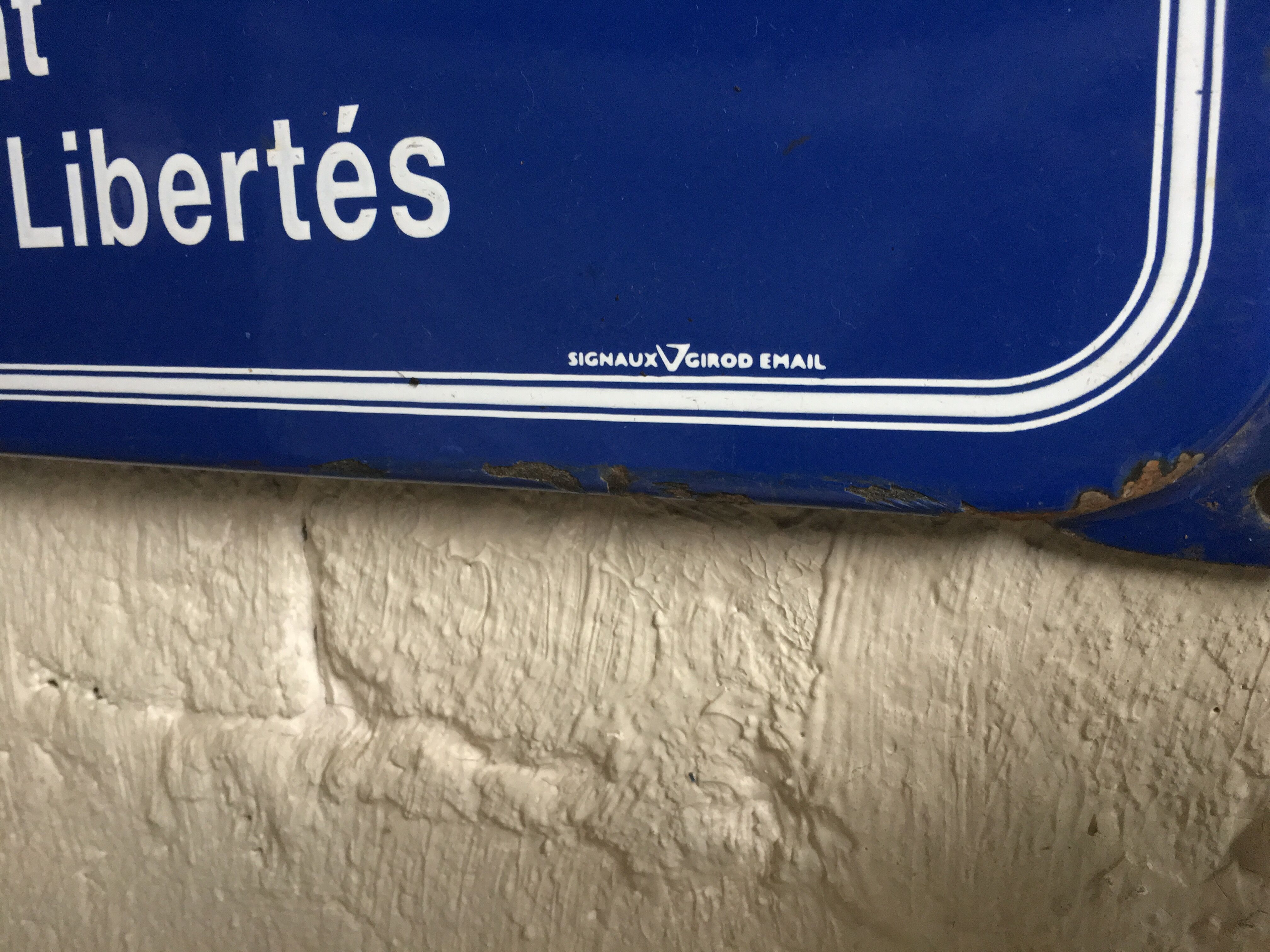 Enamelled old street sign