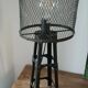 Industrial lamp in black metal to pose.