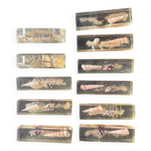 Suite de 9 porte-couteaux en résine et coquillages, années 70