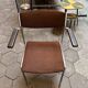 Set of 6 stackable chairs in rust colour by Gijs van der Sluis, 1970s.