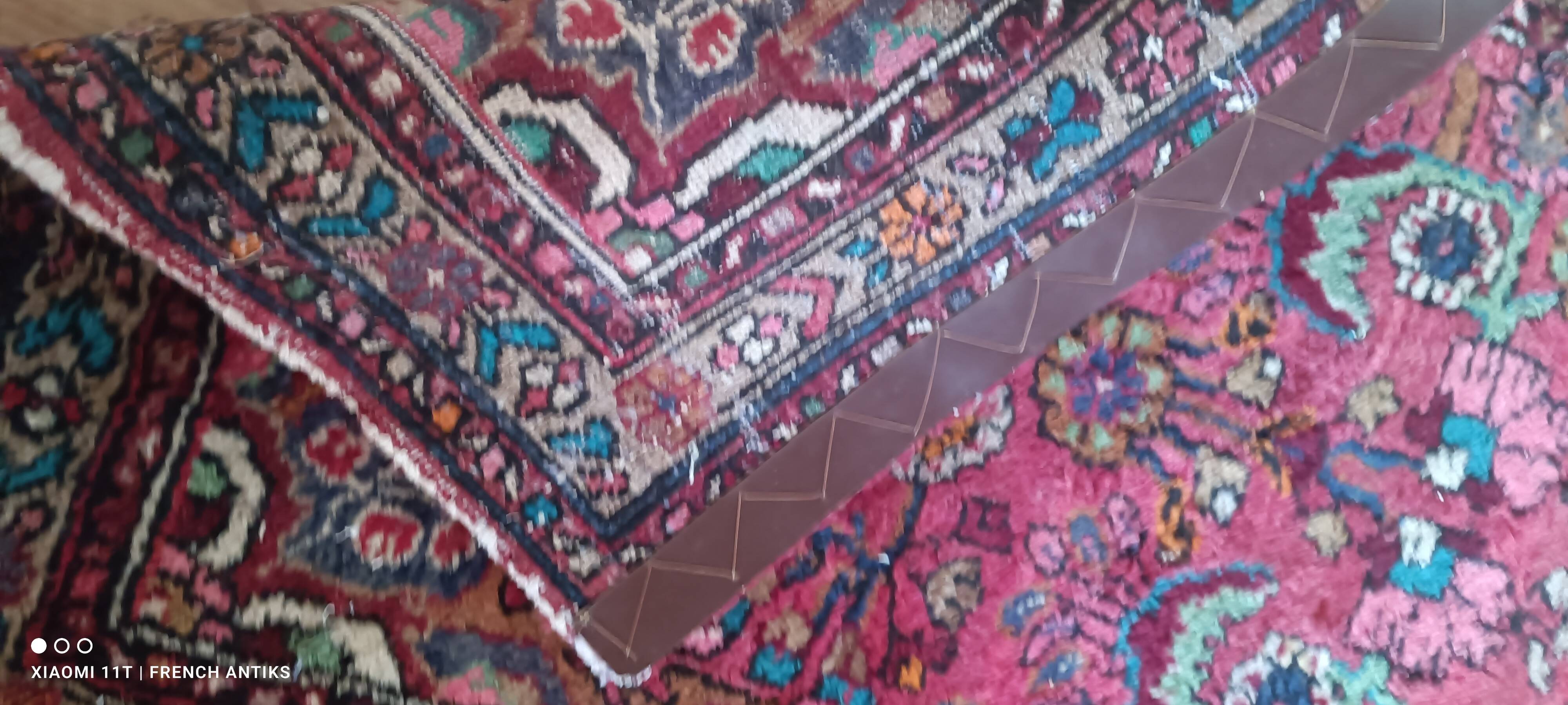 Vintage oriental rug from the 1930s. Handcrafted, handmade. Worn.