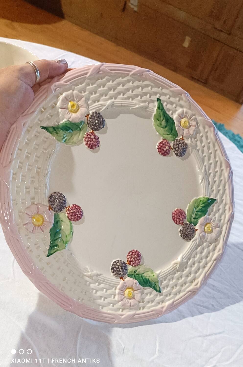 Footed dessert plate in barbotine porcelain, marked FG.