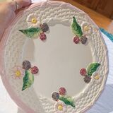 Footed dessert plate in barbotine porcelain, marked FG.