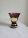 Flared vase in purple glass with a central gold motif