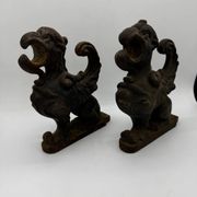 Pair of winged chimera and dragon fire dogs in cast iron
