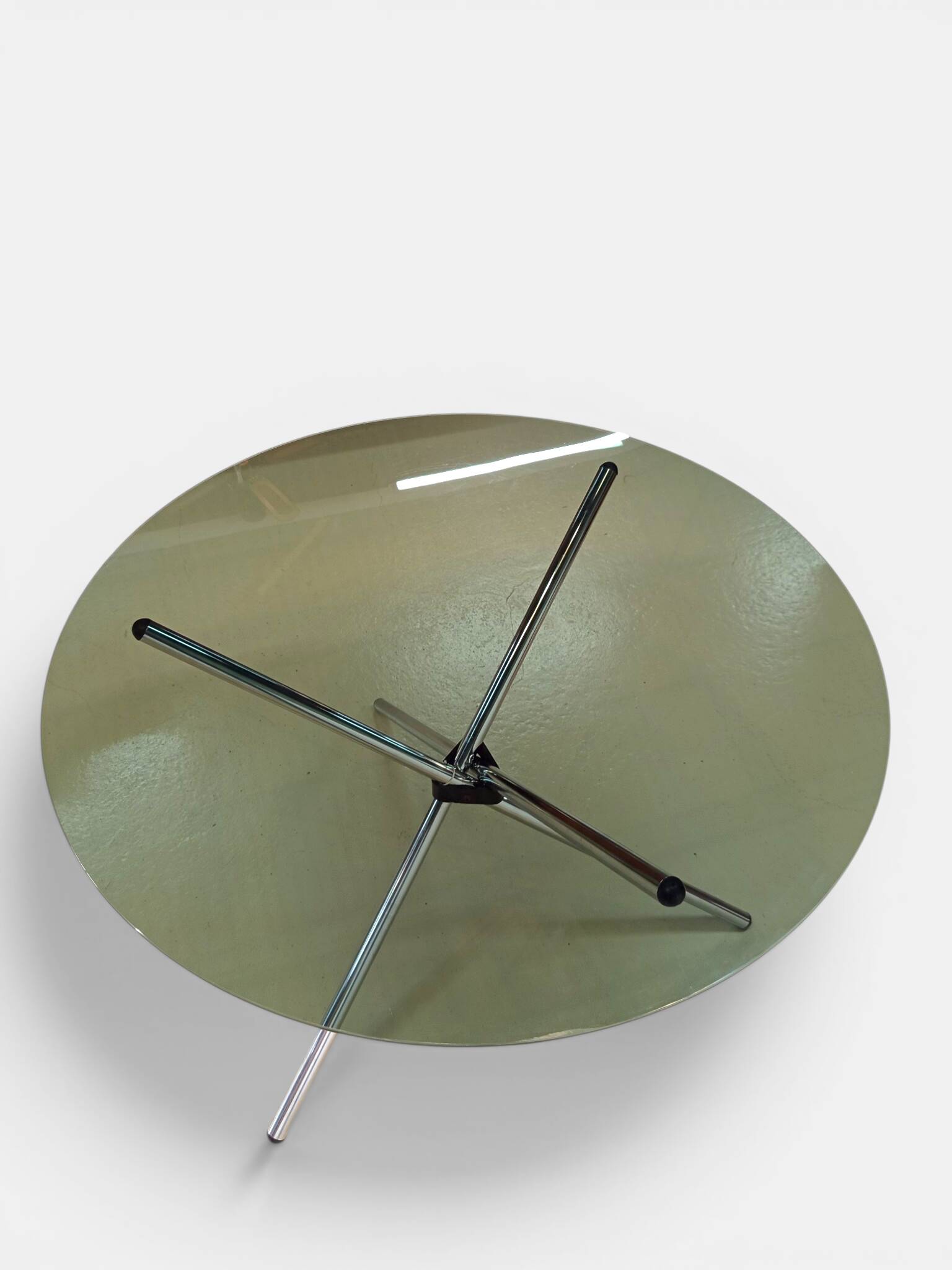 Vintage round table with smoked glass and foldable chrome legs.