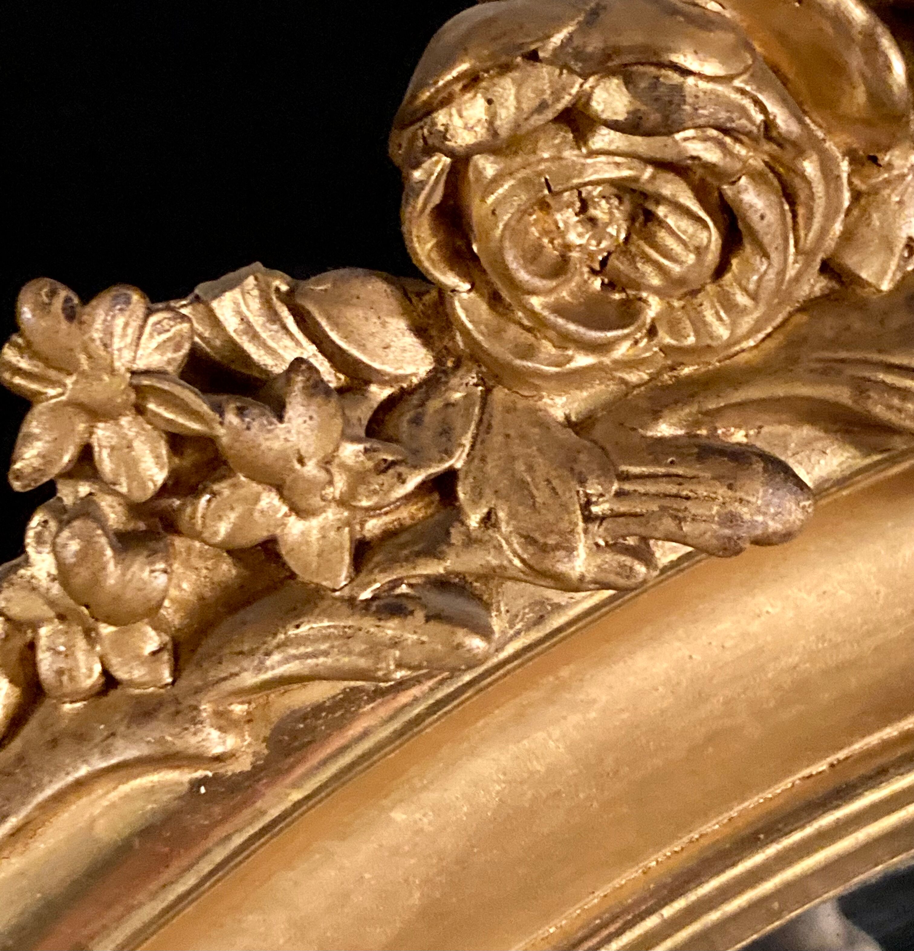 Large oval mirror in gilded wood