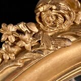 Large oval mirror in gilded wood