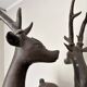 Solid bronze deer 20kg (1979), with period sales certificate.