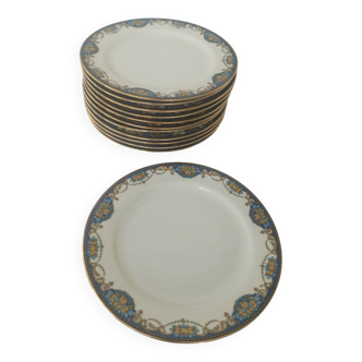12 Limoges porcelain plates decorated with garlands and fruit